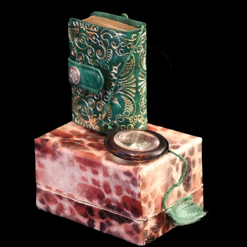 1920 Rare Miniature 1.5" X 1" Arabic Book - The Koran (Quran) published by Hans Steinbrener with magnifying lens.