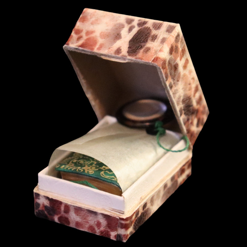 1920 Rare Miniature 1.5" X 1" Arabic Book - The Koran (Quran) published by Hans Steinbrener with magnifying lens.