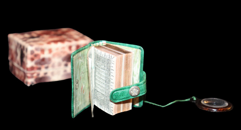 1920 Rare Miniature 1.5" X 1" Arabic Book - The Koran (Quran) published by Hans Steinbrener with magnifying lens.
