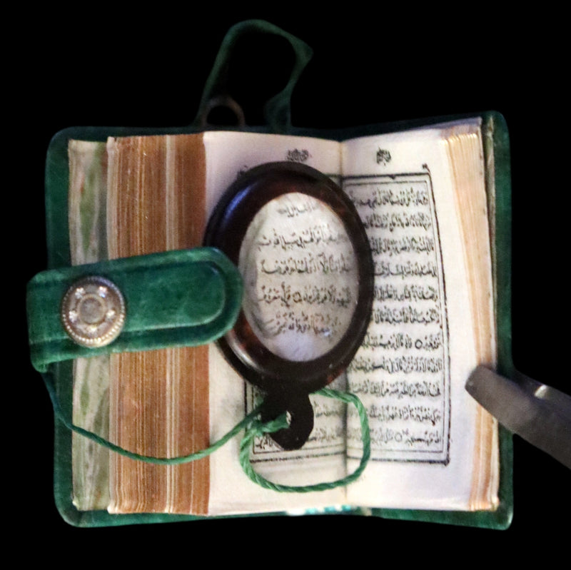 1920 Rare Miniature 1.5" X 1" Arabic Book - The Koran (Quran) published by Hans Steinbrener with magnifying lens.