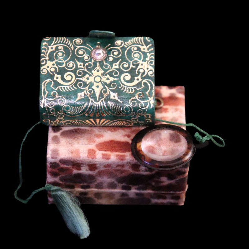 1920 Rare Miniature 1.5" X 1" Arabic Book - The Koran (Quran) published by Hans Steinbrener with magnifying lens.