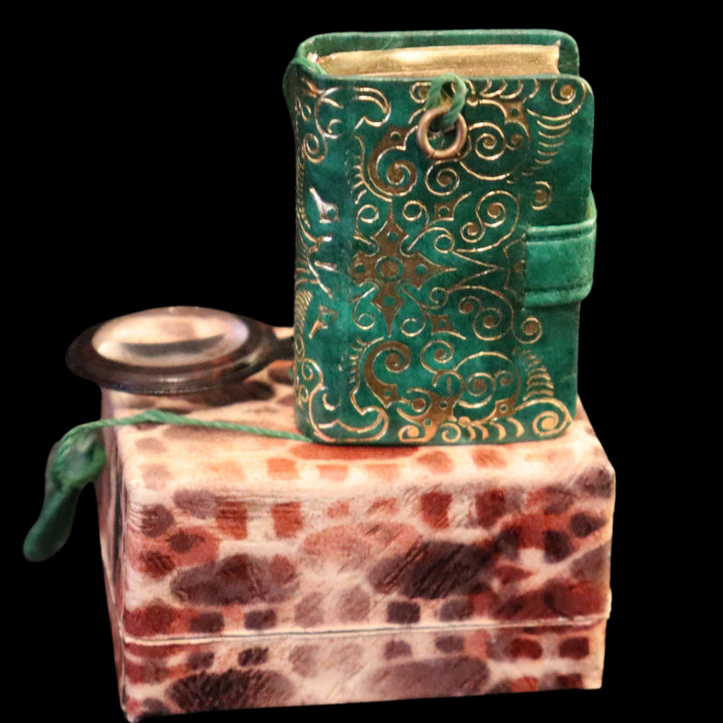 1920 Rare Miniature 1.5" X 1" Arabic Book - The Koran (Quran) published by Hans Steinbrener with magnifying lens.