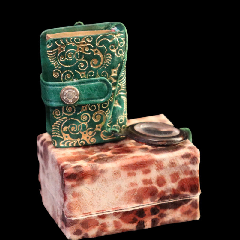 1920 Rare Miniature 1.5" X 1" Arabic Book - The Koran (Quran) published by Hans Steinbrener with magnifying lens.