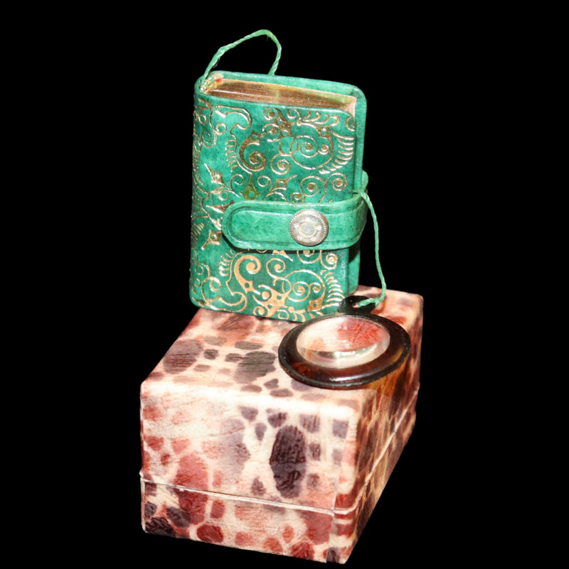 1920 Rare Miniature 1.5" X 1" Arabic Book - The Koran (Quran) published by Hans Steinbrener with magnifying lens.