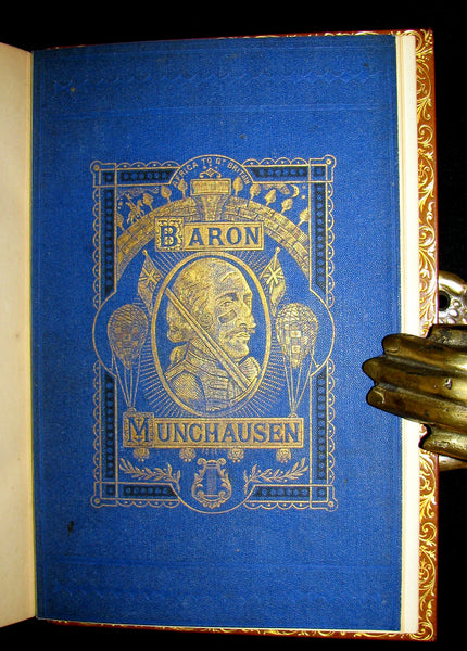 1868 Nice Bartlett & Co Binding - The Travels and Surprising Adventures of Baron MUNCHAUSEN. Illustrated in COLOR by Cruikshank.