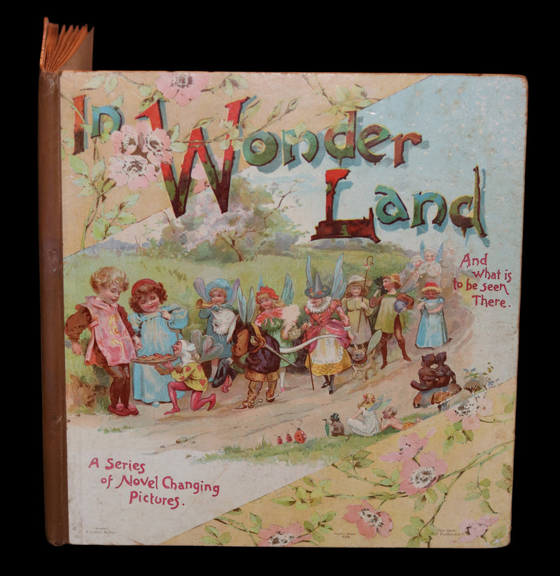 1896 Scarce Nister Revolving Toy Book - IN WONDERLAND with 8 chromolithographed volvelles.